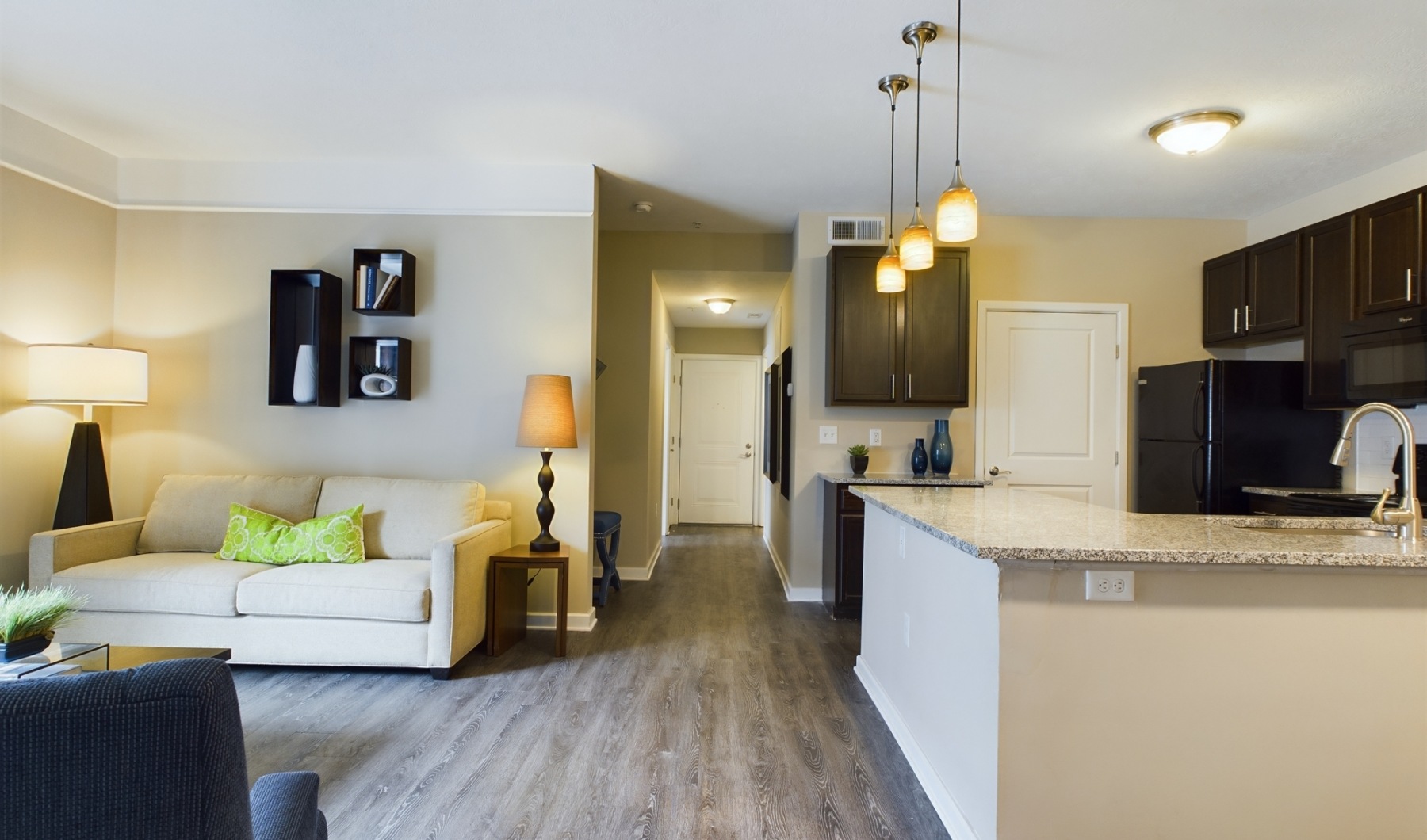 Relax and unwind in stylish living spaces Apartment with wood flooring